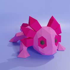 a pink origami pig laying on its side