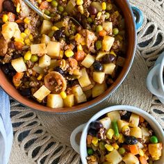 two bowls filled with food on top of a table