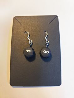 Do you love Spirited Away?!  Do you find the soot sprites to be absolutely adorable?! Perhaps a pair of Soot Sprite earrings to accompany you on your daily activities are the perfect thing for you then!  Each individual sprite will have a different expression. The earrings are made from hypoallergenic stainless steel, polymer clay, and painted myself! As always, feel free to message me if you are interested in something that I do not have listed! I am more than happy to do a custom order. Handmade Black Novelty Earrings, Quirky Handmade Black Earrings, Fun Black Hypoallergenic Earrings, Black Hypoallergenic Fun Earrings, Handmade Black Casual Earrings, Handmade Casual Black Earrings, Handmade Fun Black Earrings, Fun Handmade Black Earrings, Fun Black Earrings