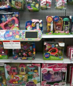 there are many toys on the shelves in this store, and one is for sale