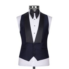 Package Includes: 1 x Jacket - 1 x Waistcoat - 1 x Pant

Upgrade your formal attire with our Dark Navy Blue Tuxedo, a blend of modern style and classic refinement. Expertly tailored for a flattering fit, this tuxedo promises both comfort and a sleek silhouette. The deep navy color adds a contemporary flair to the traditional black, ideal for weddings, galas, and any elegant affair. Constructed from high-quality fabrics, it features a satin shawl lapel and coordinated trousers, radiating luxury and elegance.

 	Fabric: 120s 
 	Lining Fabric: Silk
 	Pattern: Plain
 	Buttons: Black Fabric
 	Construction: Half Canvas
 	Seasonality: All Season
 	Jacket: Peak Lapel, 2 Flap Pockets, Single Button Closure
 	Waistcoat: Shawl Lapel 3 Buttons Closure
 	Trouser: Grey Flat front, 2 Back Pockets, Zip Cl Elegant Fitted Outerwear For Black-tie Events, Dapper Single Breasted Three-piece Suit For Formal Occasions, Dapper Three-piece Single Breasted Suit For Formal Occasions, Dapper Single-breasted Three-piece Suit For Formal Occasions, Elegant Single Breasted Tuxedo For Black Tie, Tailored Tuxedo With Notch Lapel, Classic Single-breasted Tuxedo For Black Tie, Tailored Notch Lapel Tuxedo, Fitted Three-piece Suit For Business