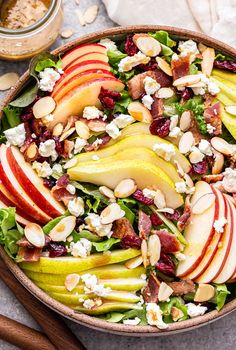 an apple and pear salad in a bowl with the title above it reads, autumn apple pear salad