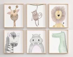 four children's wall art prints with animals and giraffes on them