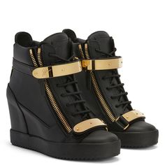 Wedge trainer black with two gold metal straps with logo, zip fastening at the sides and rubber sole with wedge inside. High Heel Sneakers Wedges, Biker Babe Outfit, Wedge Trainers, Unique Boots, High Heel Sneakers, Lace Up Wedges, Metal Straps, Unique Shoes, Biker Boots