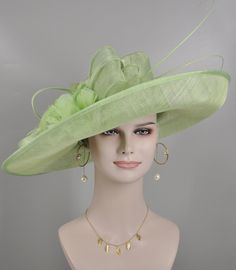 "https://www.youtube.com/shorts/0SWUprbeWfw With my little son's help, I finished the video on Youtube, it is very hard for the people to get a right size hat due to the big head size, please check the video, it will help you.  Description: This beautiful sinamay hat is an elegant wear at any church or derby event. its sinamay material is not too intimidating and attracts the eye. The chic flower adnorment that rests on the wide, side sweep brim is complemented by sinamay accentuations. Material: Sinamay with feathers Crown Width; 8 inch Crown Height: 4 inch Brim Width: 18 inches Head girth is from 22' to 23.22 \" adjustable size fits  most with an adjustable cord strap for the smaller fit If you need to  some colors on the hat to match your dress, please let me know Color on screen may va Spring Church Fascinator In Sinamay, Spring Church Sinamay Fascinator, Spring Wedding Costume Hats And Headpieces In Sinamay, Elegant Summer Church Costume Hats And Headpieces, Sinamay Fascinator For Garden Party, Elegant Green Fascinator For Church, Elegant Green Church Fascinator, Formal Sinamay Hats And Headpieces For Kentucky Derby, Elegant Cloche Costume Hat For Garden Party