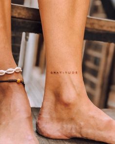 a woman's foot with the word squattified written on her left ankle