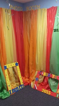 the photo booth is decorated with rainbow colors