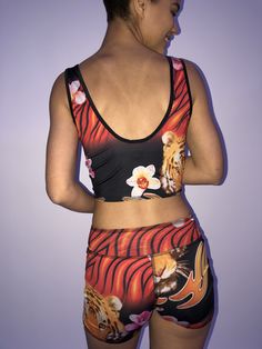 These comfortable and cute cropped bralets can be worn with the matching sports bra for added support. Paired with one of the many matching shorts, this top can be worn in the studio, as a bathing suit or out on the street. double sided with 2 different yet complimenting prints, made from recycled water bottles and spandex UV protection Moisture-wicking Crop Top Activewear For Summer, Casual Sports Crop Top With Built-in Bra, Athleisure Crop Top With Built-in Bra For Beach, Summer Moisture-wicking Crop Top Activewear, Trendy Racerback Crop Top For Sports, Cropped Tank Top For Gym In Summer, Summer Cropped Moisture-wicking Activewear, Cropped Moisture-wicking Summer Activewear, Moisture-wicking Cropped Activewear For Summer