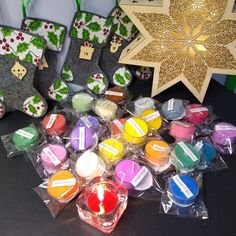 several small candles are on the table next to some christmas decorations and other holiday items