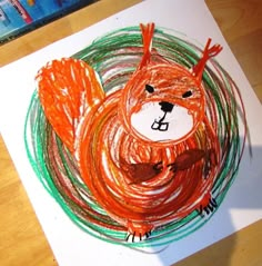 a child's drawing of a squirrel in the middle of a painting on paper