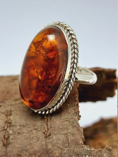 Amber Silver Ring Amber Ring,Orange Cabochon Oval Ring Sterling Silver Ring,Amber Semi Precious Stone Ring,Engagement Ring,Best Seller Amber Ring Why To Wear Silver As a metal, silver has significant health benefits that have been used across cultures for centuries. Silver has a proven track record as a powerful antimicrobial agent fighting infections and aiding in cold and flu prevention, wound healing, and more. Silver also helps with internal heat regulation and circulation. Why To Wear Amber Formal Orange Oval Rings, Classic Orange Rings With Polished Finish, Classic Orange Oval Cabochon Rings, Orange Rings With Polished Finish For Anniversary, Formal Orange Cabochon Ring, Amber Sterling Silver Oval Cabochon Ring, Oval Amber Cabochon Ring, Amber Oval Cabochon Sterling Silver Ring, Classic Amber Oval Cabochon Ring