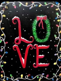 a christmas card with the word love written in red and green