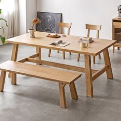 a wooden table with two benches next to it