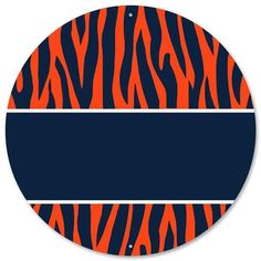 an orange and black zebra print on a round sticker with a blue strip in the center