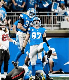 the football players are celebrating on the field