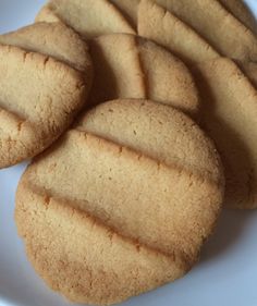 a white plate topped with cookies on top of a table