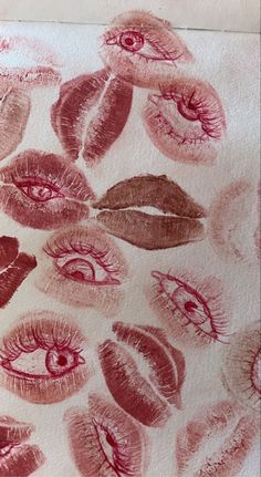 lipstick kisses drawn on paper with colored pencils in the shape of eyes and lips