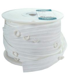 a spool of white cotton cord