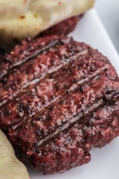 a close up of a steak on a plate