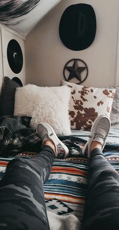 a person laying on top of a bed in a room