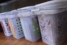 plastic storage containers lined up on a wooden floor