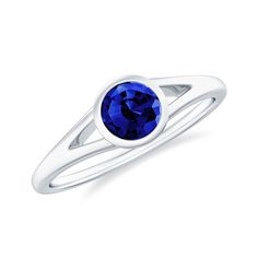 Product Details This stunning solitaire ring features a 5 MM round Created Blue Sapphire as its centerpiece, set in a bezel setting and enhanced by a gorgeous split shank design. The Created Blue Sapphire ring is crafted from solid gold, making it an eye-catching and sophisticated piece of jewelry. Product Information SKU SHP-RINGS0721121592 Width 6 mm Height 3.5 mm Weight 1.76 gm (Approximate) LAB CREATED BLUE SAPPHIRE INFORMATION No.of Stones 1 Pieces Total Weight 0.65 Carat (Approximate) Dimension(approx) Round-5X5 mm-1 Pcs Color Blue Cut Brilliant Shape Round Setting Type Other-Setting Quality Grade AAAA View More Product Parent Collection Handle lab-created-blue-sapphire-rings Blue Sapphire Ring With Bezel Setting, Blue Birthstone Ring With Bezel Setting For Formal Occasions, Formal Blue Birthstone Ring With Bezel Setting, Blue Bezel Set Round Cut Birthstone Ring, Classic Blue Ring With Bezel Setting, Sapphire Jewelry With Tension Setting, Modern Blue Rings With Bezel Setting, Sapphire Bezel Set Round Band Jewelry, Blue Solitaire Birthstone Ring With Round Band