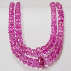 "Pink Sapphire Faceted Rondelle Beads Sparkling Sapphire Gemstone Beads Sapphire Beads Strand Wholesale Sapphire Beads AAA+ Gemstone Type :  Pinkish Sapphire  Item Code :   8700 Grade-:  AAA++ Stone shape-: Faceted Rondelle Beads Stone color-: Pinkish Metal-:           925 Sterling silver Length-:        17 Inch Long Strand Quantity-:     1 Strand Necklace Approx Weight   : 125 .80 Carat    Beads Size        :   4 TO 6  MM MOST BEAUTIFUL SAPPHIRE STRAND FOR JEWELRY MAKING AND GIFT FOR ANYONE. If you have any questions about this item please contact me I will get back to you as soon as If you want More Quantity in Any Necklace then you can get it in our company.  ABOUT US skgemsstone based in Jaipur, India is a company engaged in supplier, manufacturing, wholesale and retail business of Gem Art Deco Pink, Sapphire Beads, Jaipur India, Sapphire Gemstone, Bead Strand, Strand Necklace, Pink Sapphire, Semiprecious Stones, Beautiful Necklaces