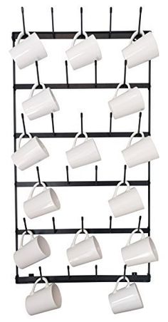 coffee mugs are hanging on a rack with cups attached to the top of them