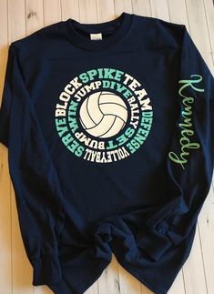 a long sleeved shirt that has a volleyball on it