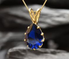 Gold Sapphire Pendant set with a Created Sapphire - flawless diamond cut, clarity & deep blue color, 16x12mm, 10 Carats. Teardrop Necklace ☞ Gold Vermeil: thickest 18k Gold Plating on Solid 925 Sterling Silver ☞ made to last. Matching Ring: www.etsy.com/uk/listing/1072538449 Matching Earrings - please ask me Details :  ♥ Each item comes in a cute GIFT BOX ✓ ♥ GUARANTEE on the materials ✓ ♥ Created Sapphire - teardrop diamond cut & flawless ✓ ♥ Pure Solid 925 Sterling Silver ☞ Silver Hallmark on Sapphire Necklace Gold, Morganite Pendant, Teardrop Diamond, Blue Sapphire Necklace, Ring Matching, Flawless Diamond, Blue Topaz Pendant, Large Stone, Matching Ring