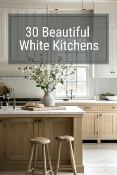 a kitchen with two stools in front of the counter and an island that has flowers on it