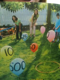 an advertisement for balloons with the number twenty five on it and people in the background