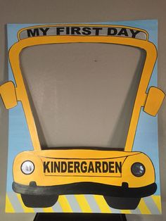 a cardboard school bus with the words my first day on it's front door