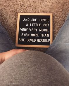 a sign that says and she loved a little boy very much even more than she loved herself