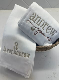 two personalized towels in a basket with the words, andrew and a is for andrews