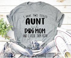 I have two titles Aunt and Dog Mom and I rock them Both 🐶🐾🐕 Sassy Tee, Heat Press Designs, Auntie Shirts, Aunt Shirts, Custom T Shirt Printing, Classic Wardrobe Staples, Mama Shirts, Funny Sayings