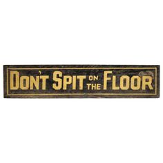 a wooden sign that says don't spit on the floor with an image of a dog