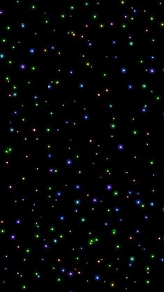 an image of many different colored lights in the night sky with no one around them