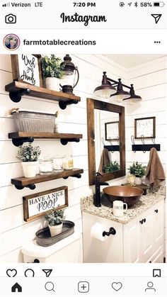 the bathroom is decorated in white and has wooden shelves with plants on top of them