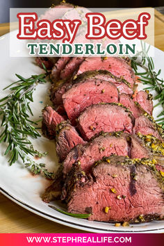 sliced beef on a white plate with rosemary garnish and text overlay that says easy beef tenderloin