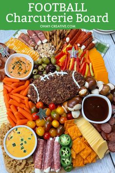 a football themed platter with cheese, crackers, meats and vegetables