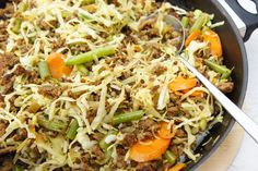 a skillet filled with ground beef and veggies