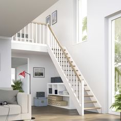 a living room filled with furniture and a stair case