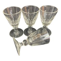 three silver goblets are sitting next to each other