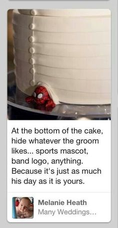 a white cake with spiderman decorations on it