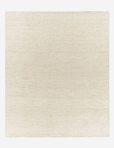 a white rug with an uneven design on it