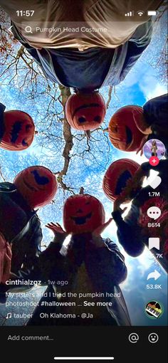 a group of pumpkins sitting on top of each other in front of a sky background