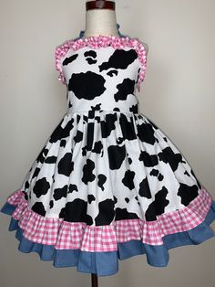 Brand new design, gorgeous handmade cow prints summer halter dress, great for trip/birthday gift.  This is the sample I made for pictures taken, size 5/6, great deal.   Bodice fully lined, skirt is very full, top-quality 100%cotton. See pictures for detail. If you prefer my normal jumper dress, or if you want different color trims, just let me know, I am happy custom make the dress you want. I am very flexible.  All items come from pet free smoke free environment. Turnaround Time: I work full time taking care of my online business. I will normally ship out your order within 1-3 days after payment receive. If you need it urgent, let me know, I will ship out your order in 1 day, no extra charge. Shipping Information: Items will be shipped by priority mail with a tracking number. Handmade In Summer Halter Dress, Cow Dress, Cow Prints, Halter Dress Summer, Handmade Brand, Lined Skirt, Sample Sale, Jumper Dress, Cow Print