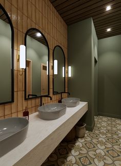 a bathroom with two sinks and three mirrors on the wall next to eachother