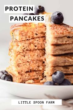 a stack of pancakes with blueberries on top and the words protein pancakes above it